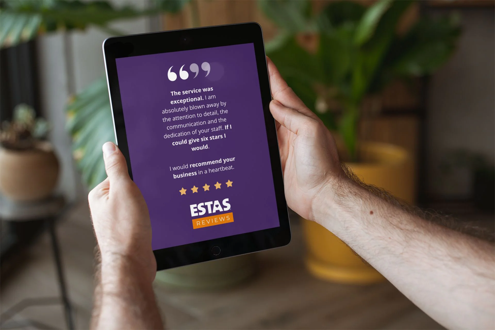 iPad being held viewing the ESTAS website