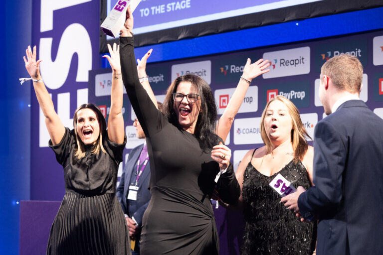 Winners celebrating on stage after receiving recognition at the ESTAS Awards